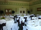 White Chair Covers and Chocolate Taffeta Sash